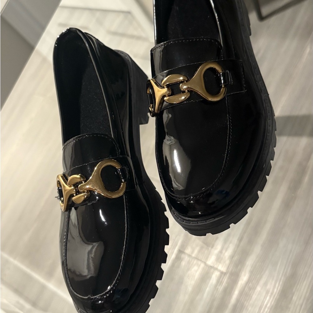 Elegant Black Loafers with Gold Accent